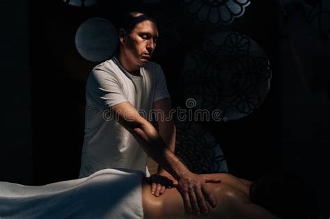 Masseur going down on client .